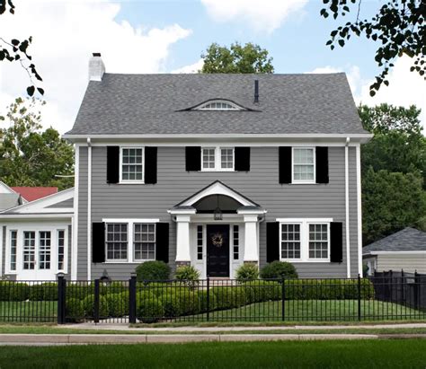 blue gray house with metal roof|grey houses with black shutters.